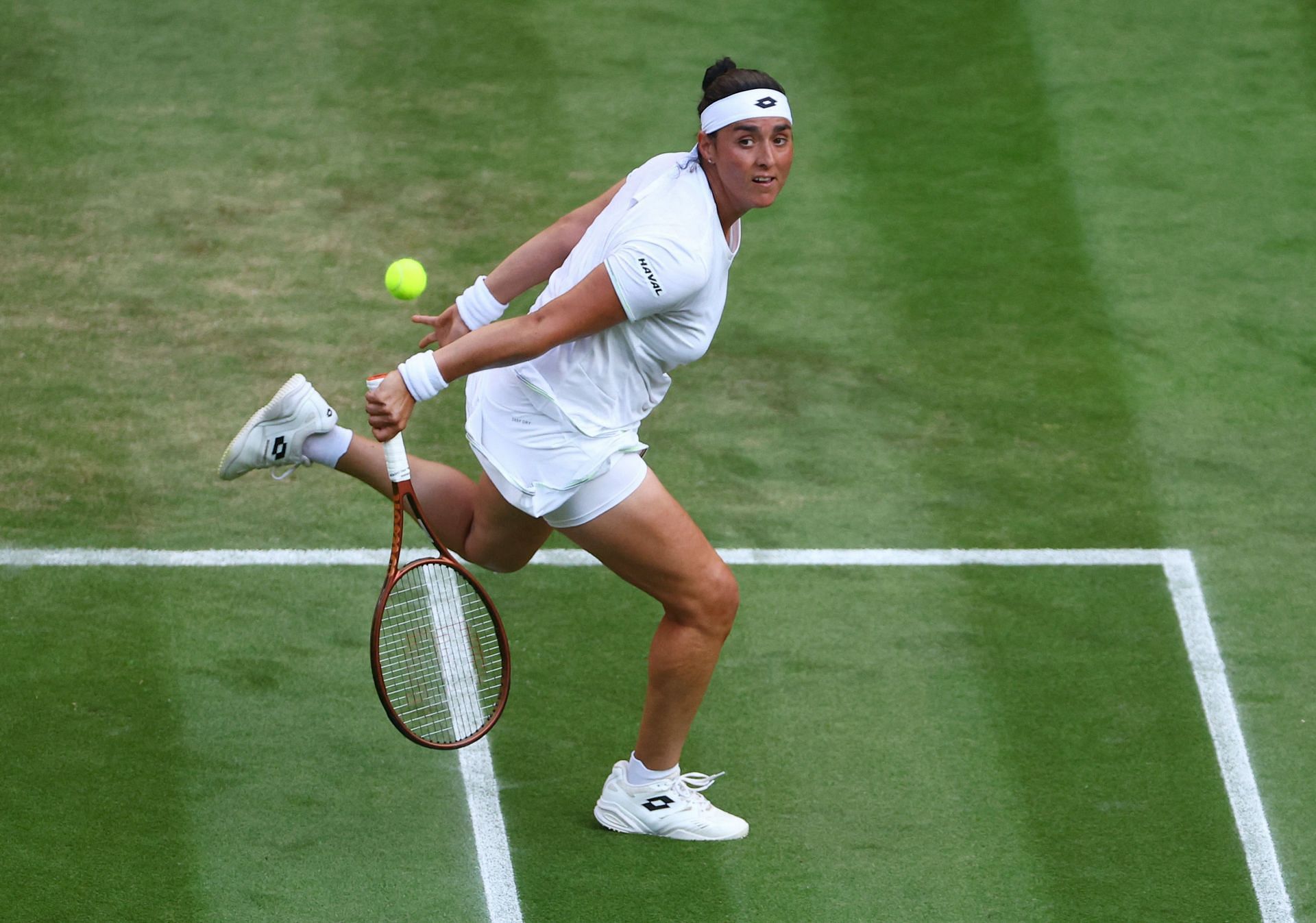 Jabeur hits a volley at 2023 Wimbledon
